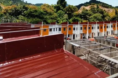 Rooftop view over townhouse rows, some still under construction